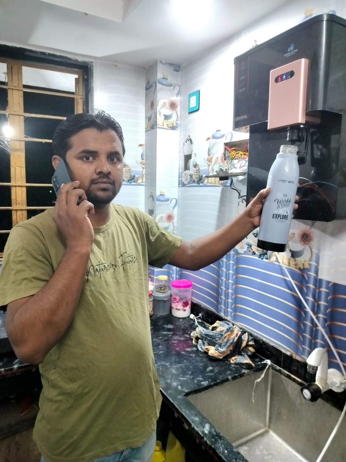NexElectra Crystal water purifier delivering clean drinking water in a customer home