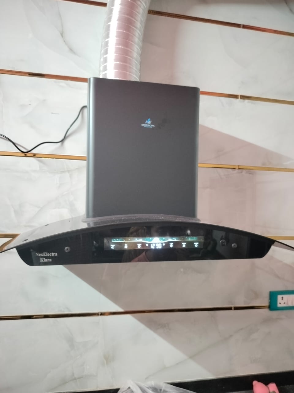 Close-up of the NexElectra Kiara kitchen chimney digital touch control panel